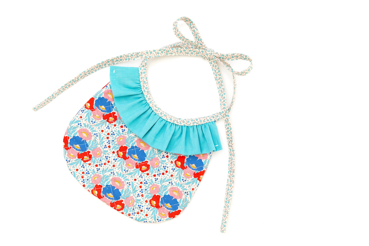 Completed multi-color bib against white background