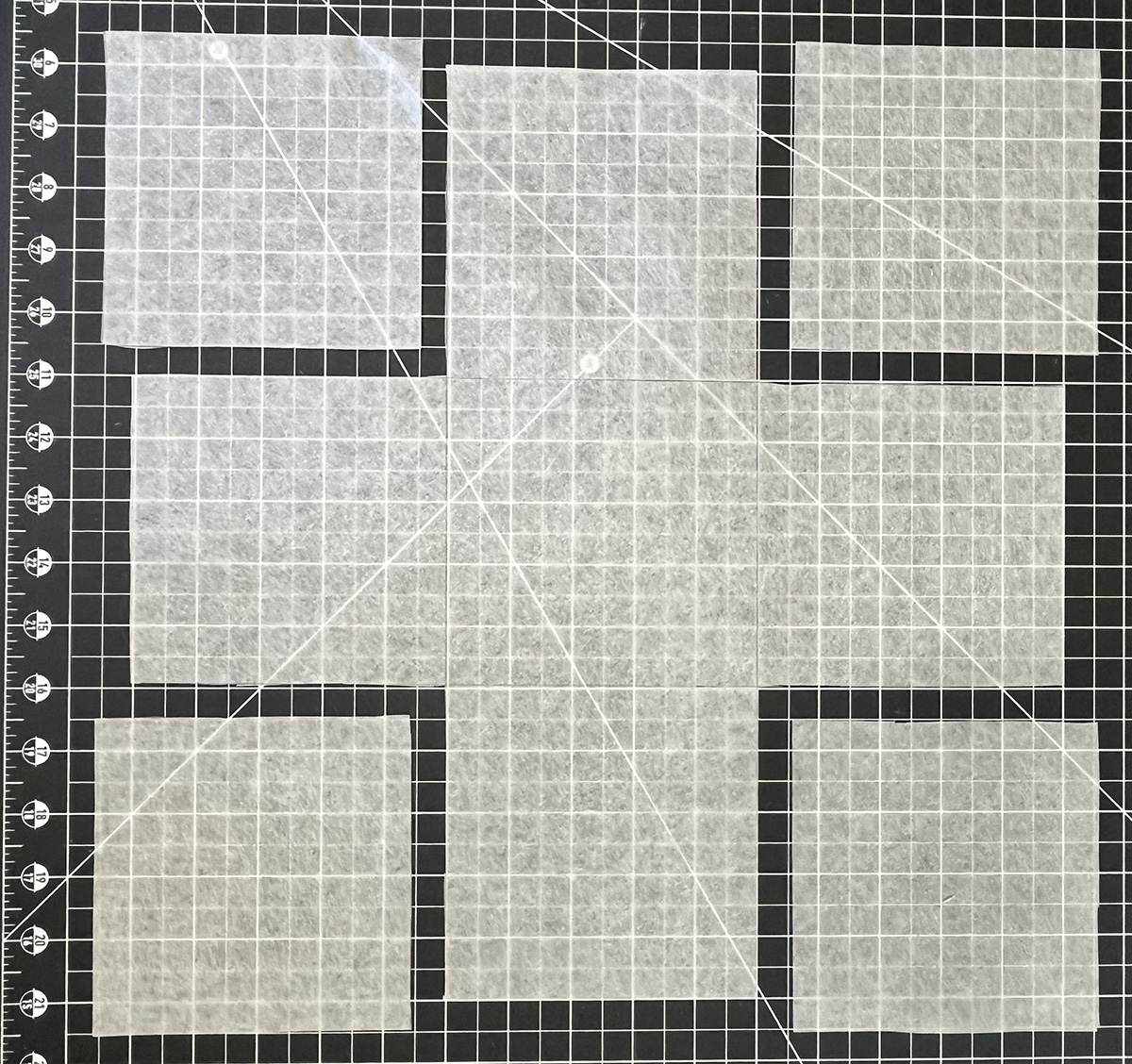 cut out pattern paper on a black and white grid.