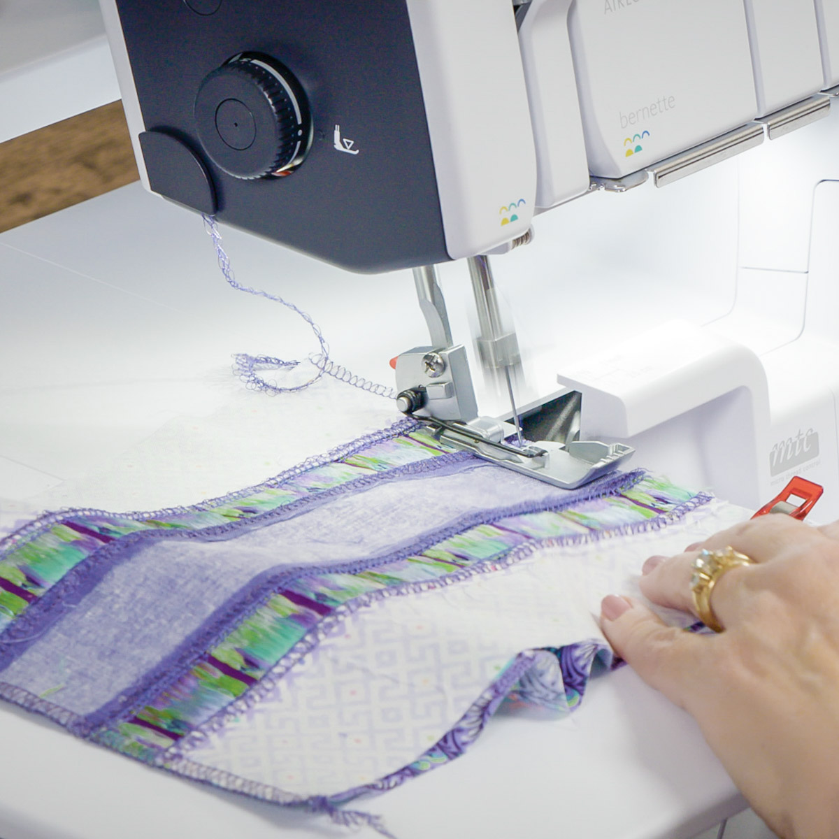 Side view of the top and bottom being sewn together.