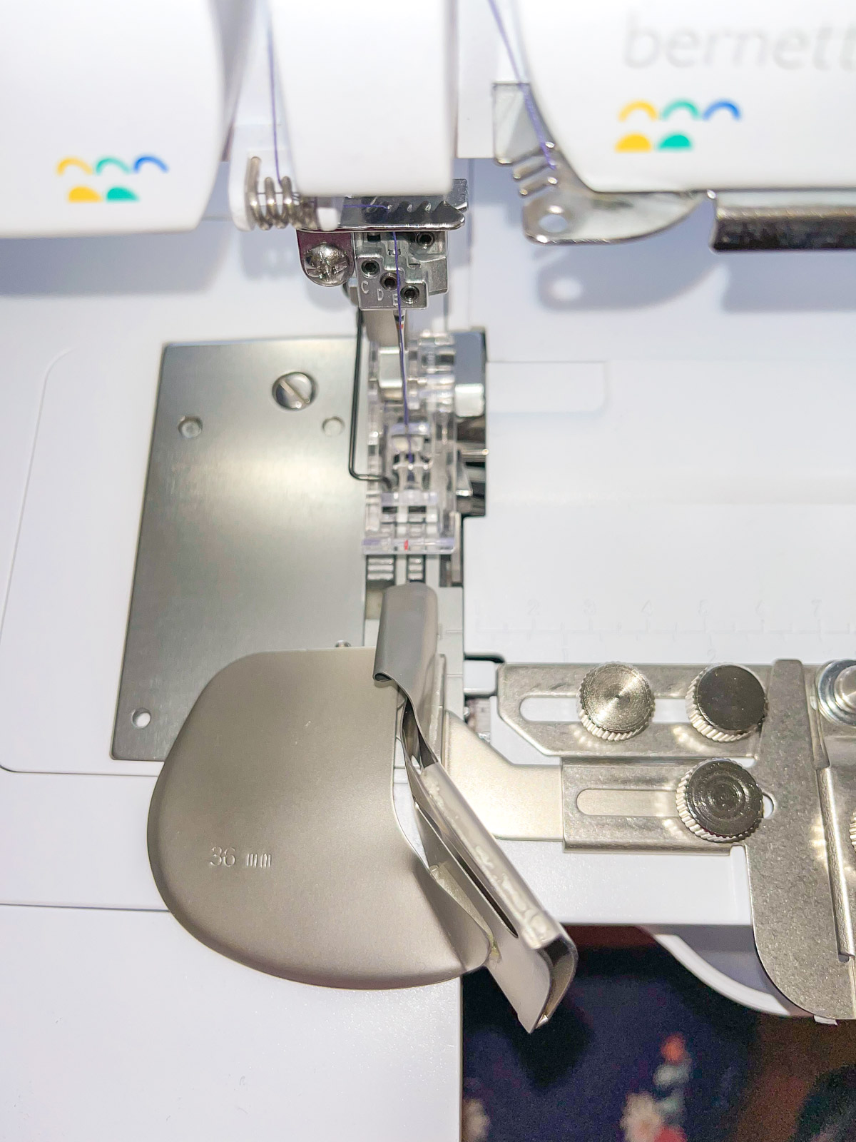 Front view of the clear foot and binder attachment on the machine.