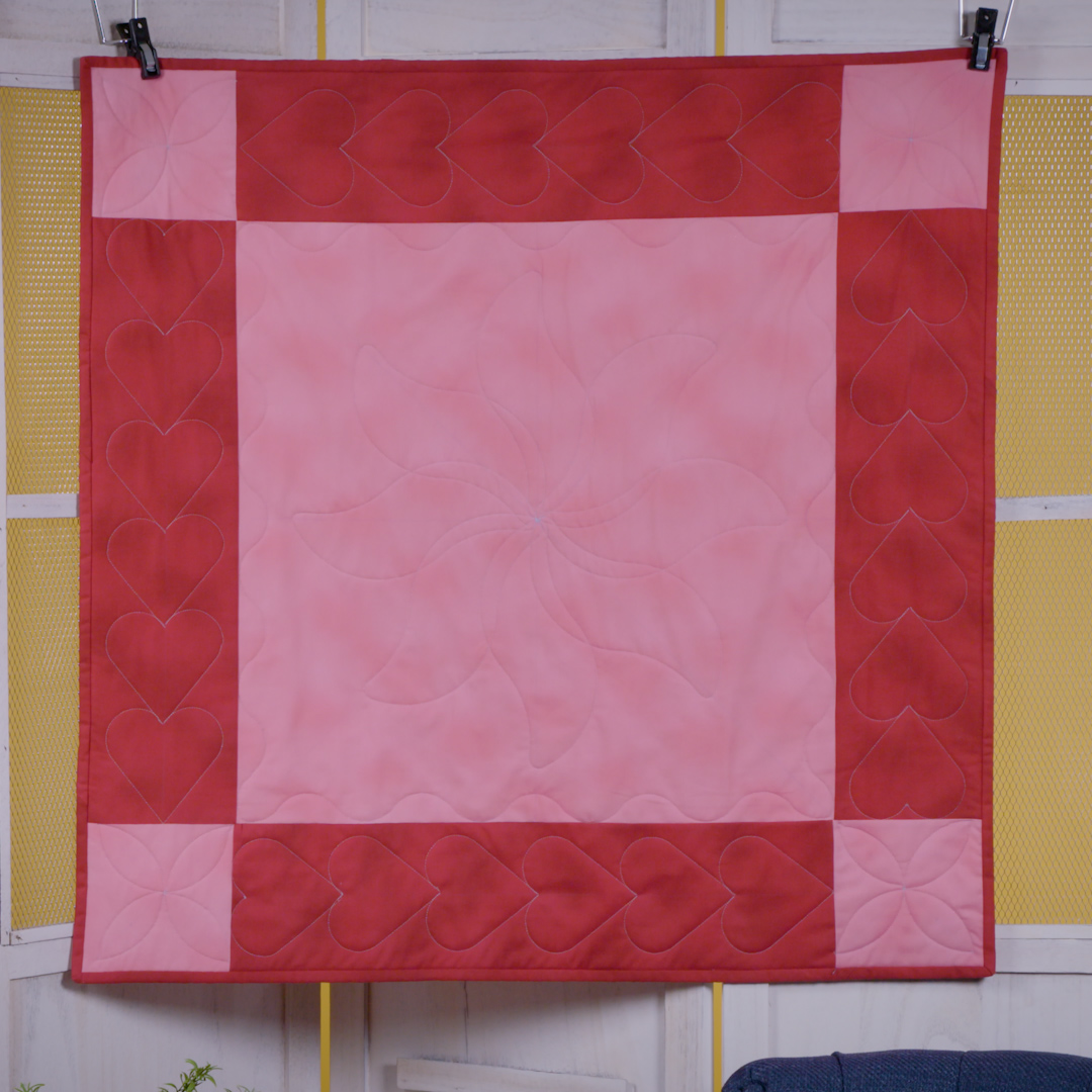 Close-up view of red and pink checkered multi curve ruler