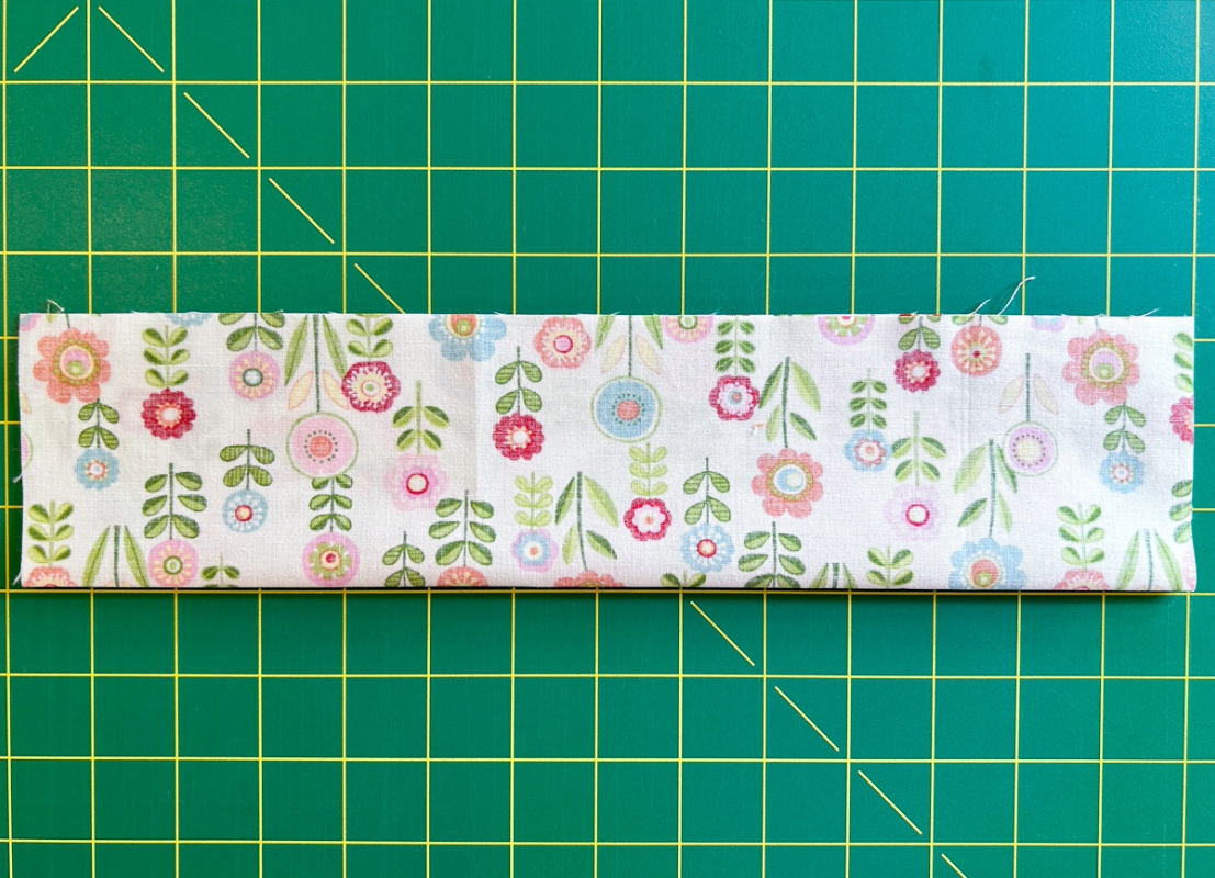 Flowered fabric folded in half lengthwise
