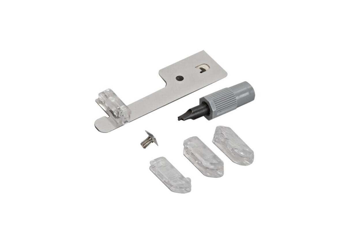 Silver presser feet attachments on a white background.