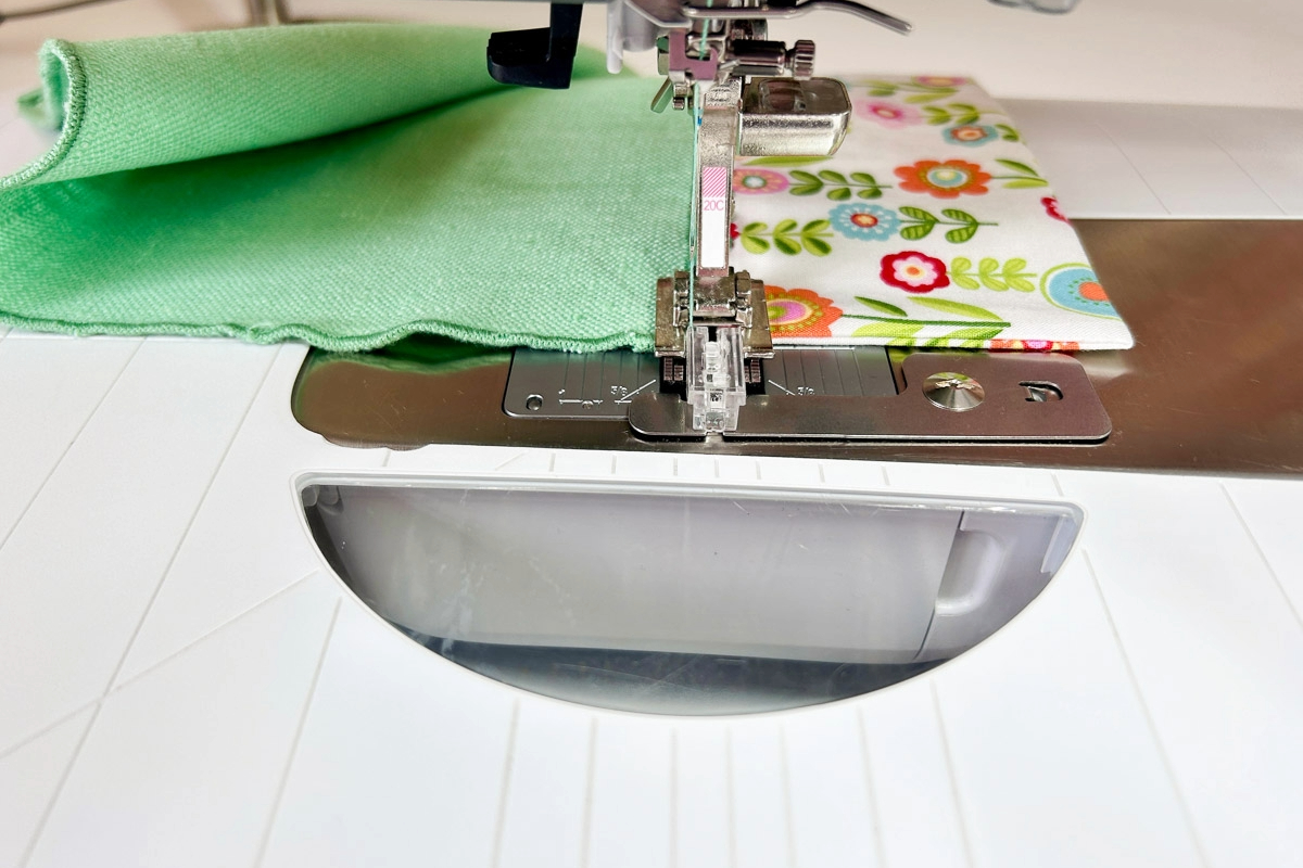 Close-up view of the final securing stitches being sewn into the two fabrics.
