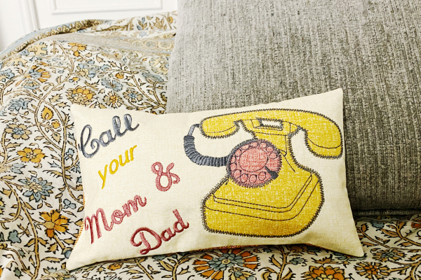In-the-hoop pillow with "Call your Mom & Dad" embroidery