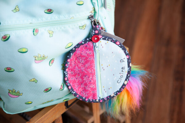 Backpack with attached mini purse