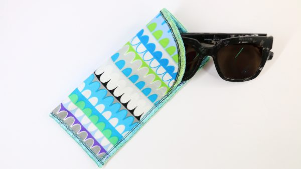 Colorful eyeglass case with glasses partially inside