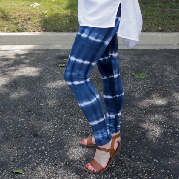 Woman wearing blue tie dye leggings outside