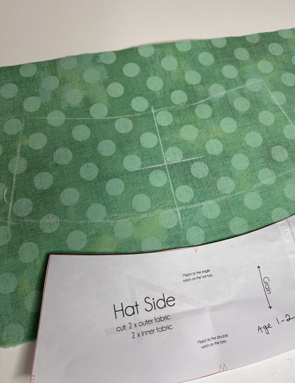 use chalk to mark center of fabric and outline crown of hat