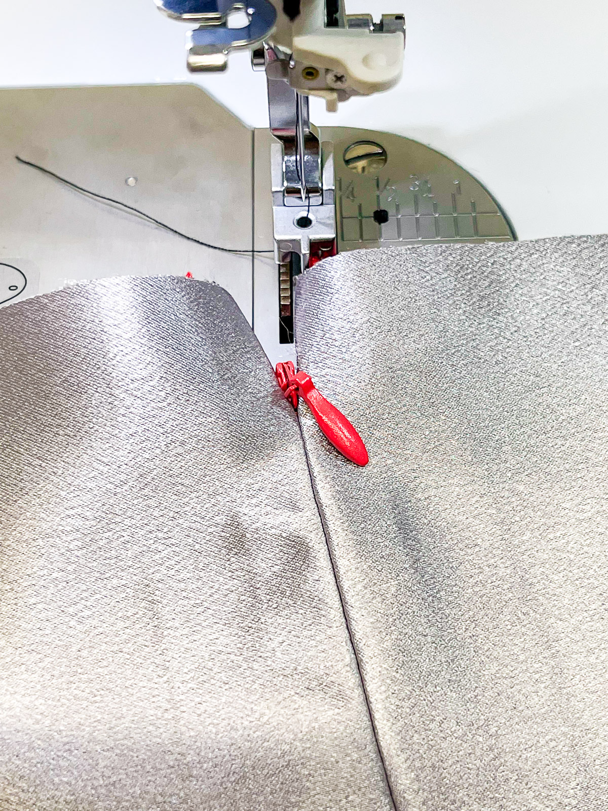 Invisible Zipper Sample Showing that the red zipper cannot be seen showing through the seam on the right side