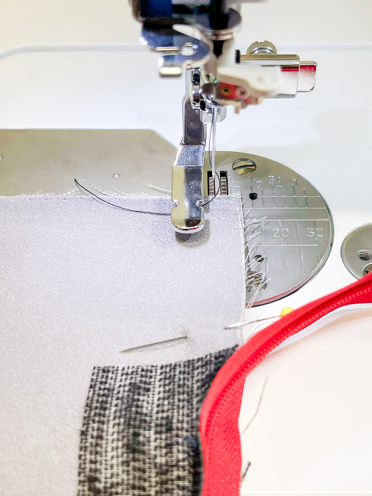 Move the Zipper Foot all the way to the left.