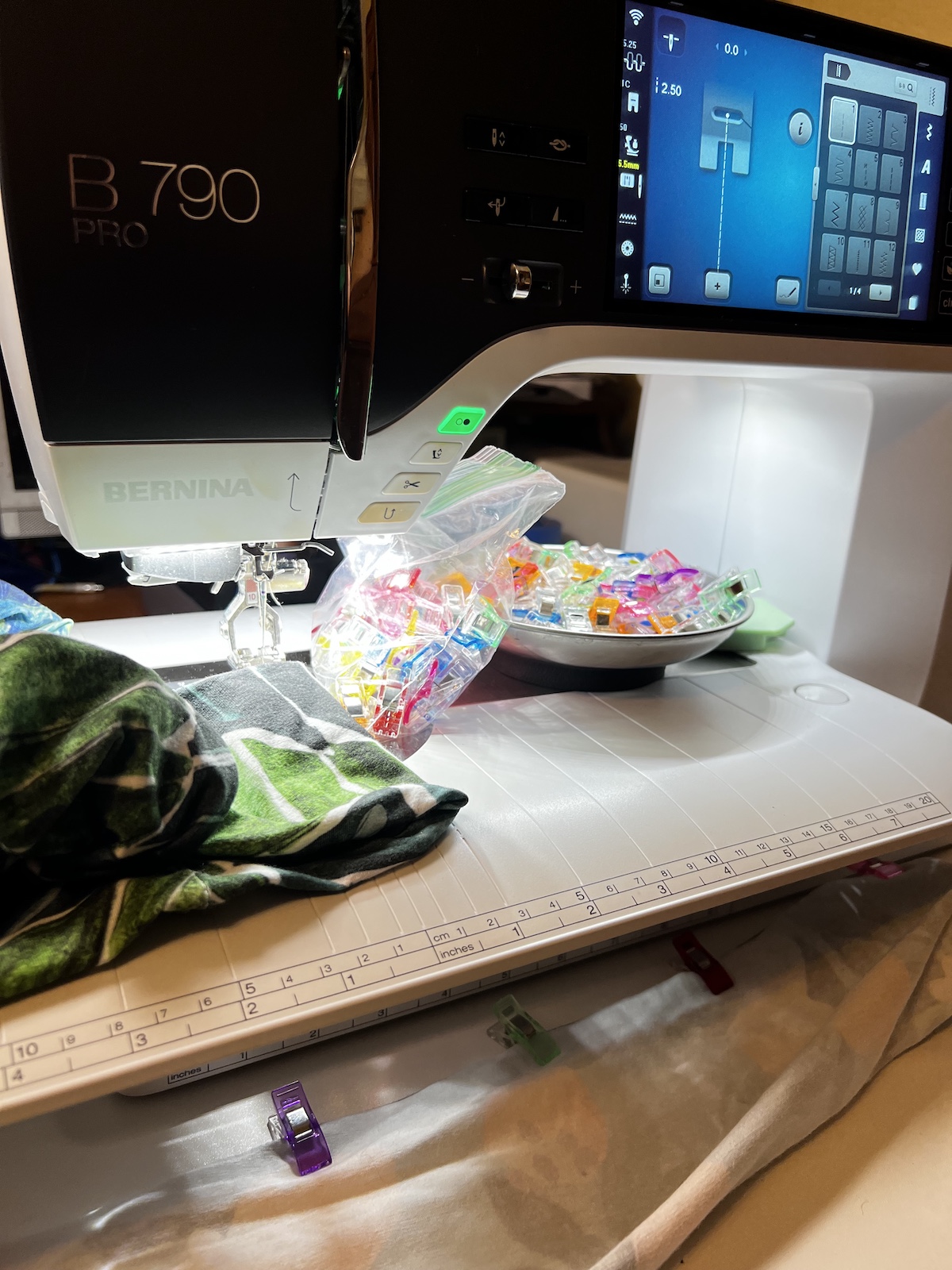 BERNINA B 790 PRO sewing machine with cotton headbands, clips and sewing supplies sitting on top