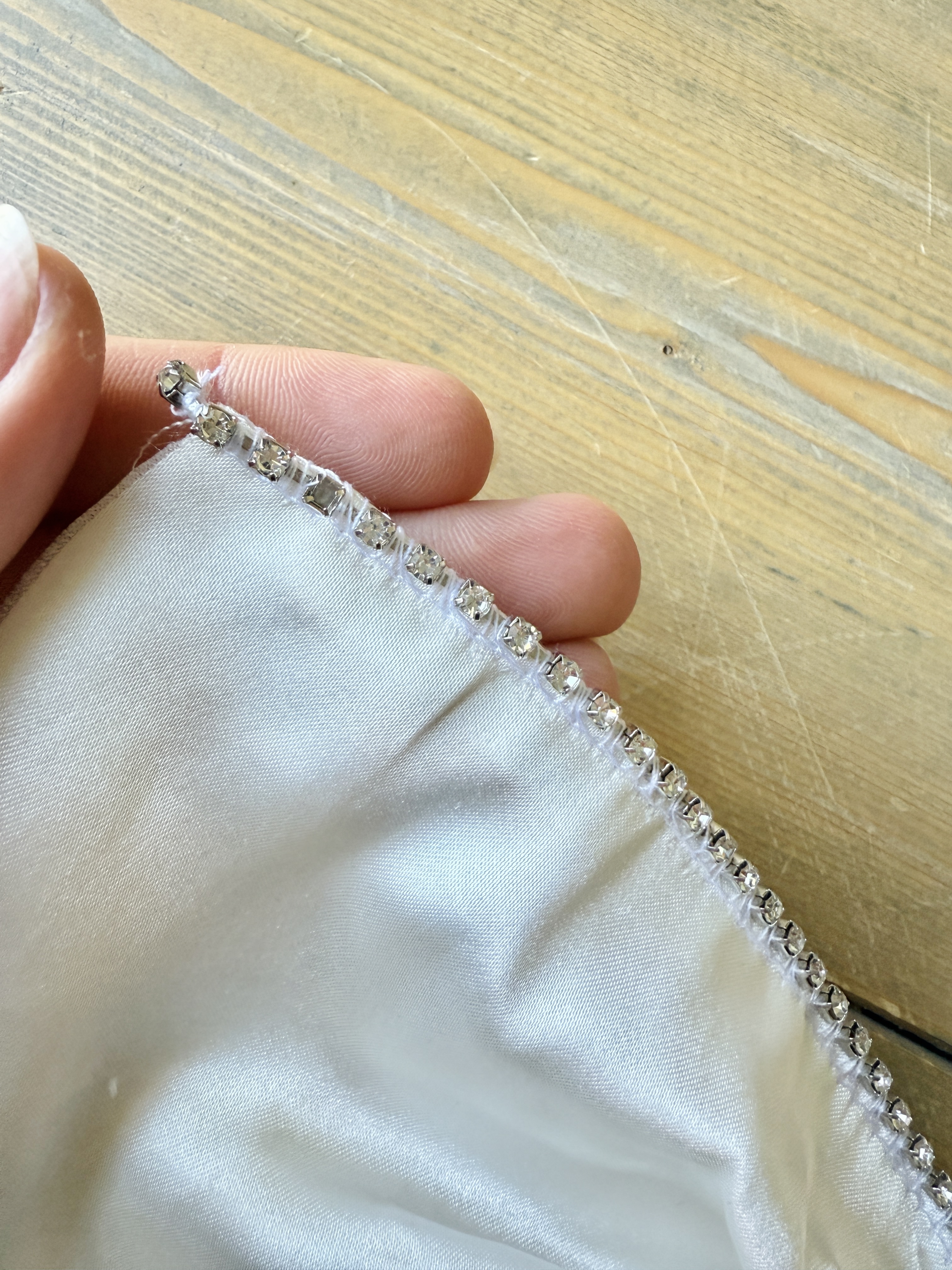 Lower the presser foot and sew a few stitches to stabilize the rhinestones. It is now prepped and ready to attach to the fabric.