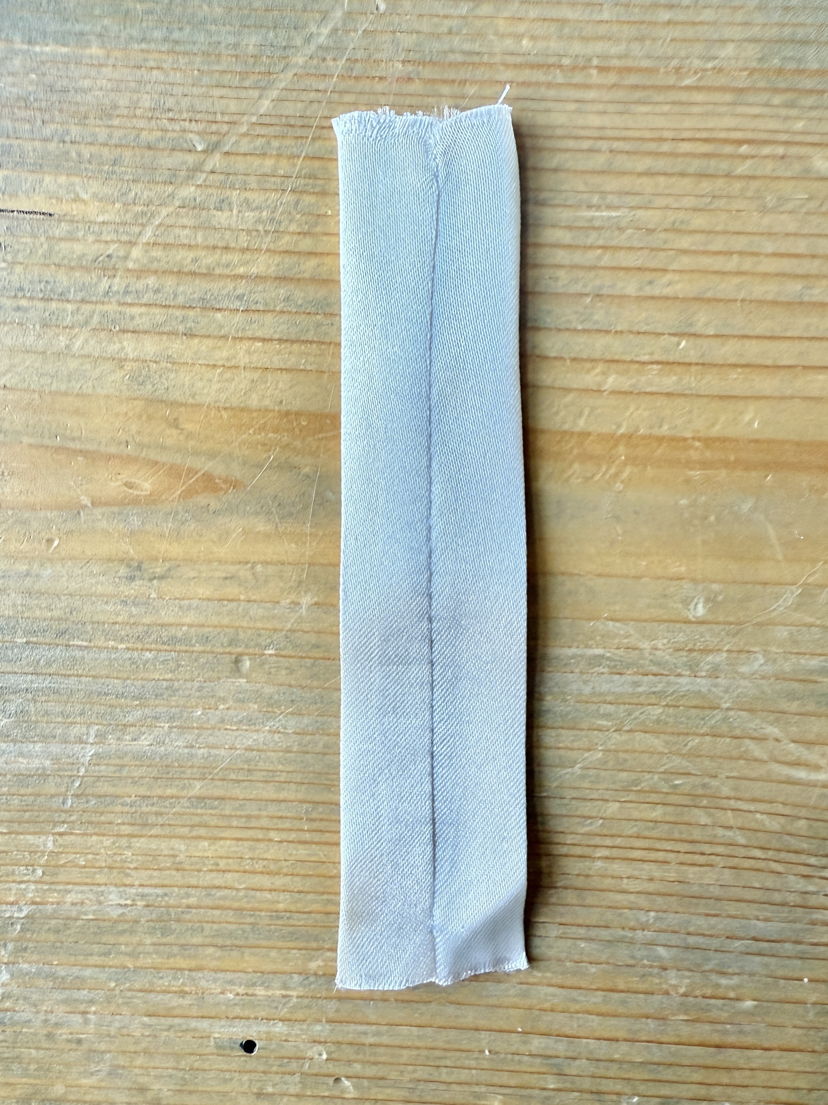 Lower the presser foot and sew a few stitches to stabilize the rhinestones. It is now prepped and ready to attach to the fabric.