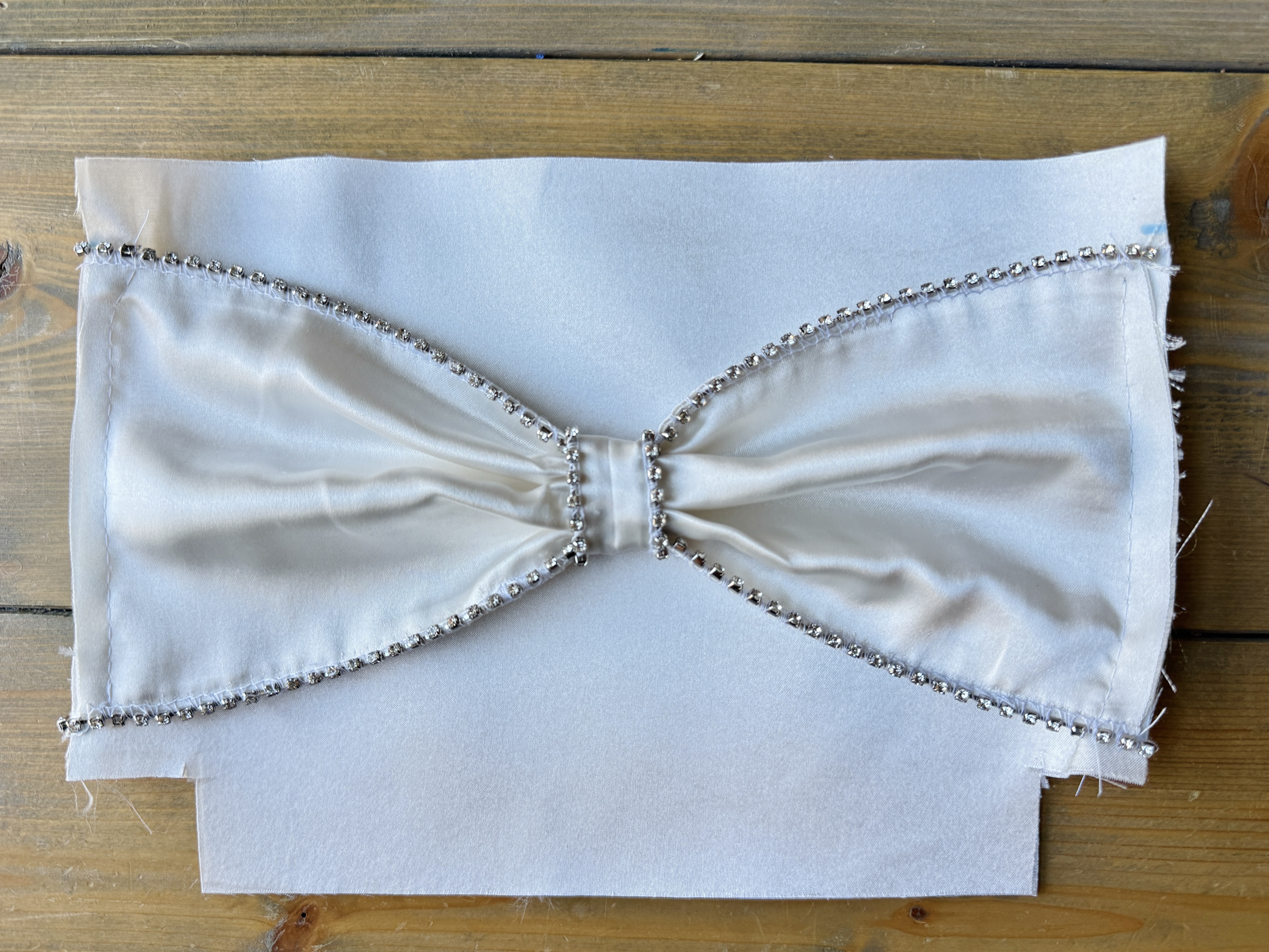 Lower the presser foot and sew a few stitches to stabilize the rhinestones. It is now prepped and ready to attach to the fabric.