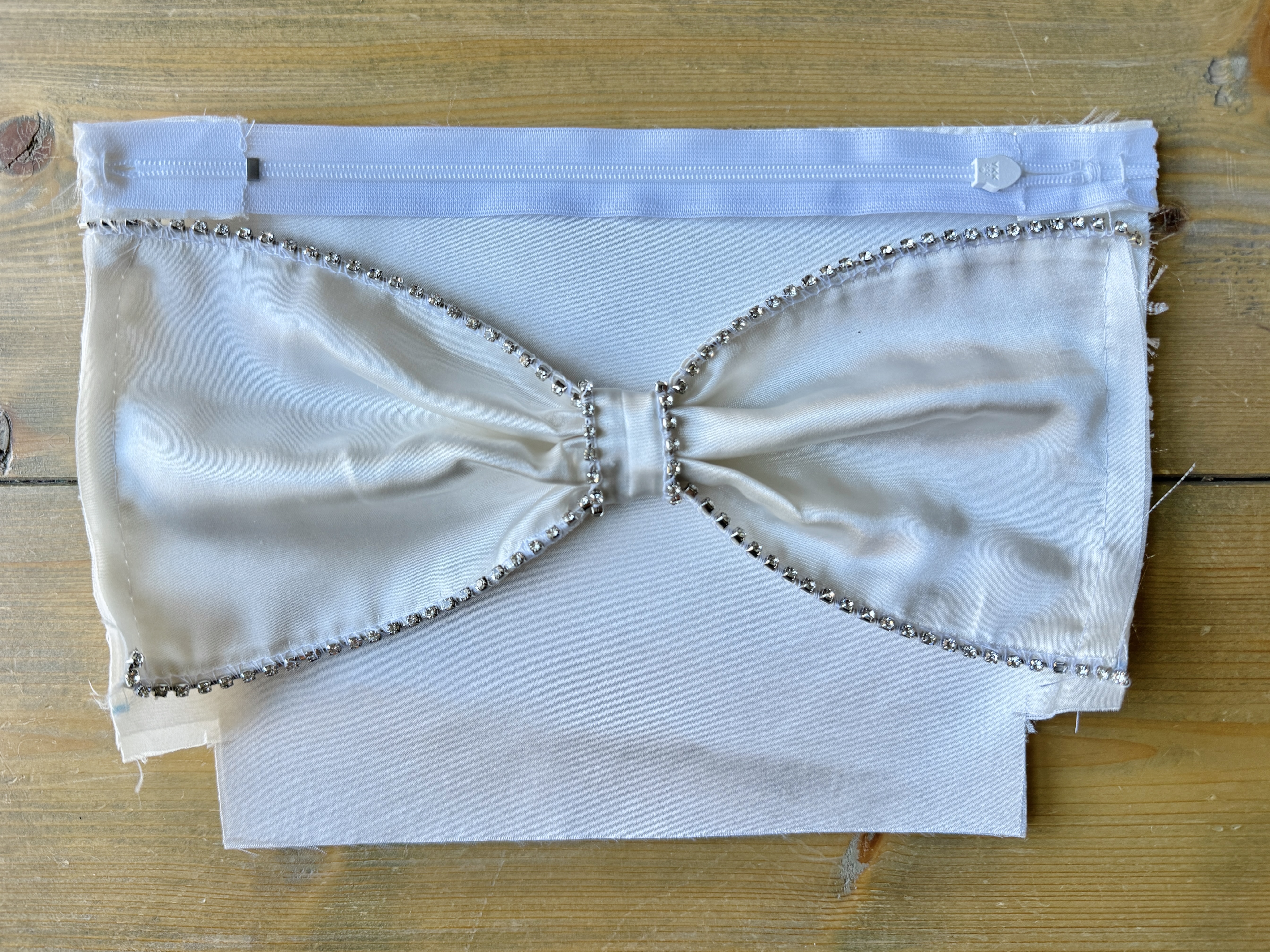 Lower the presser foot and sew a few stitches to stabilize the rhinestones. It is now prepped and ready to attach to the fabric.