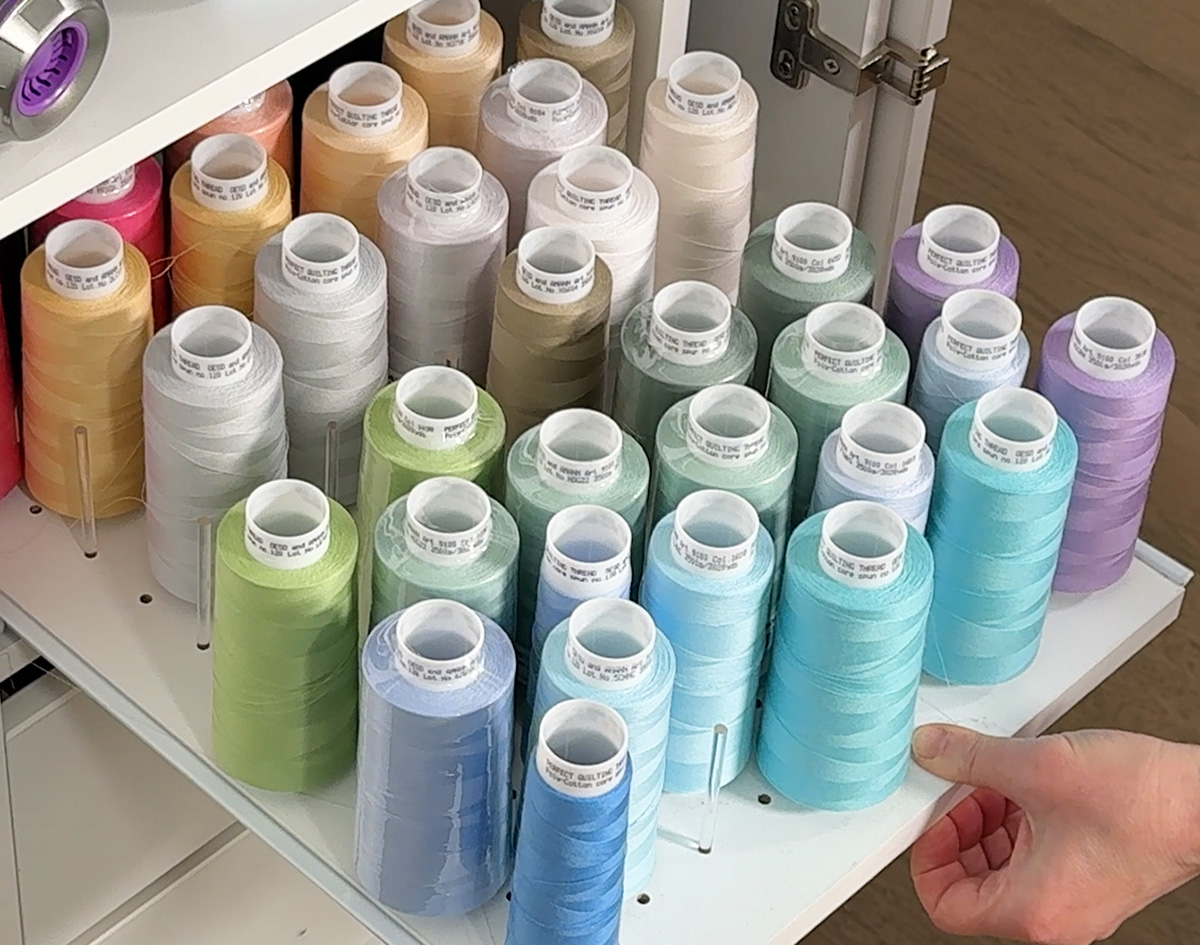 Cones of Perfect Quilting Thread are on this shelf. I'd recommend buying them in pairs - they you don't have to clip your thread to wind additional bobbins.