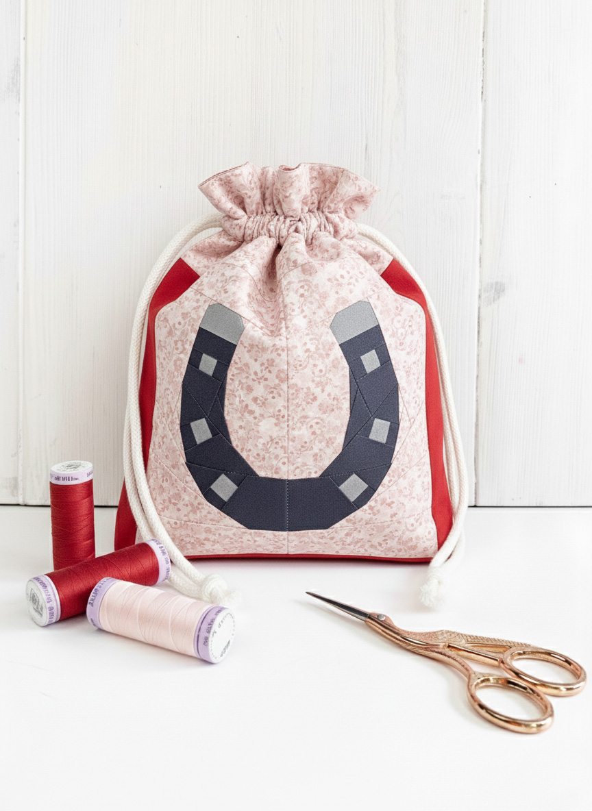 Horseshoe quilt block pattern on a drawstring bag for good luck, by Joe June and Mae
