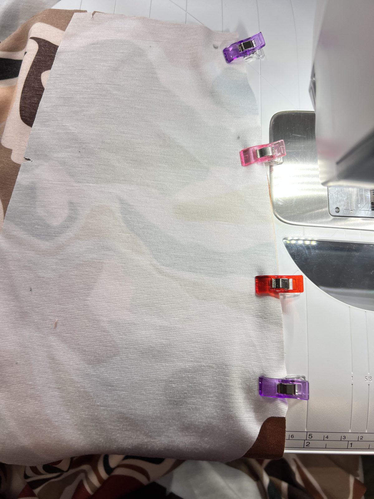Clipped pocket lining with right sides together on side seam of front pants.