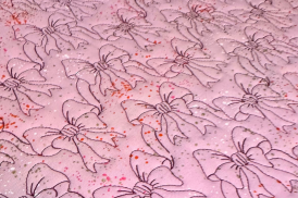 bows quilted on longarm with insulated batting