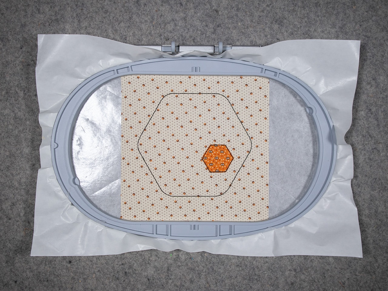 trim the hexagon fabric shape right up to the cutting stitch