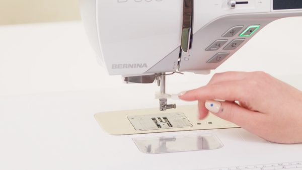Use a brush to clean the needle bar