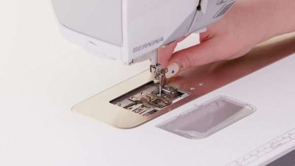 Remove loose thread with tweezers